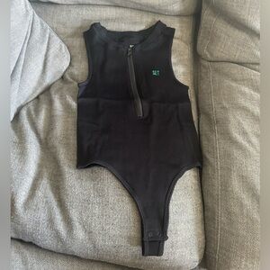 SETActive body suit size small! brand new with tags! Black with a green logo🍀